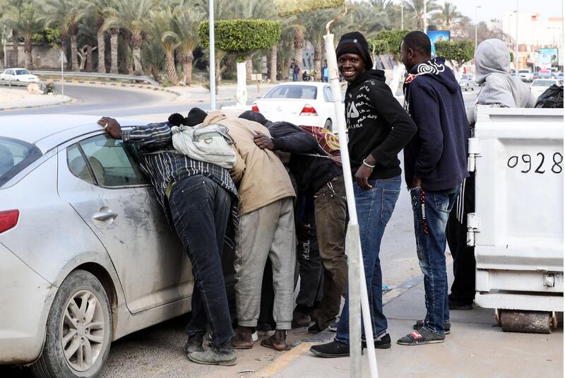 Day labourers seeking small jobs approach motorists in the Libyan capital Tripoli to be hired for casual work. Driven from home by desperation and warded off European shores, hundreds of migrants from sub-Saharan Africa are resigned to staying in the country. AFP