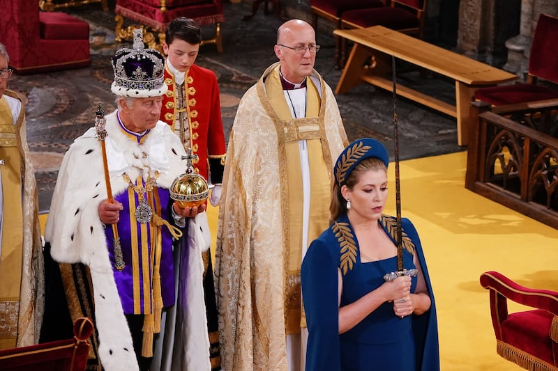 Penny Mordaunt walks ahead of King Charles III during the coronation ceremony at Westminster Abbey in London on May 6. PA