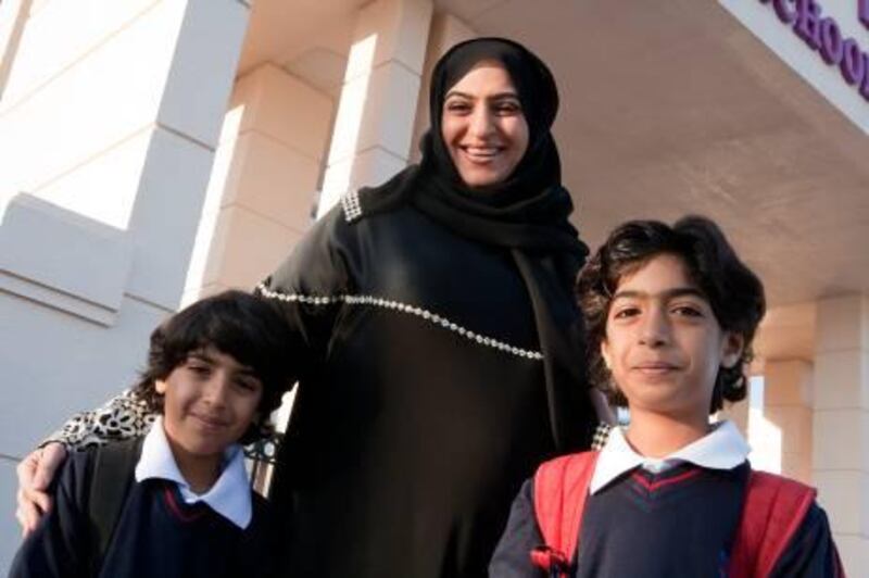 Hifa Al Ansari with her children (L) Khalid (age 7) and Salah (age 9). Duncan Chard for the National