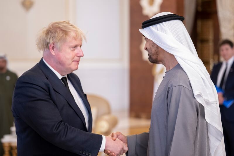 UK Prime Minister Boris Johnson speaks with Sheikh Mohamed.  Abdulla Al Junaibi for the Ministry of Presidential Affairs