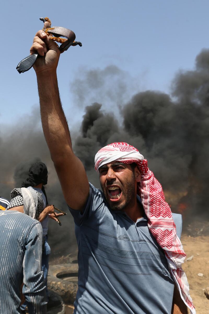 A demonstrator shouts during the protest.  Ibraheem Abu Mustafa / Reuters