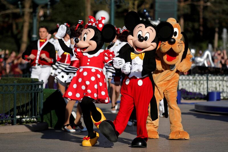 FILE PHOTO: Disney characters Mickey Mouse and Minnie Mouse attend the 25th anniversary of Disneyland Paris at the park in Marne-la-Vallee, near Paris, France, April 12, 2017.    Picture taken April 12, 2017.   REUTERS/Benoit Tessier/File Photo