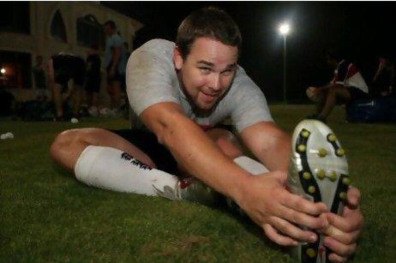 Pete Sampson stretches after practice.