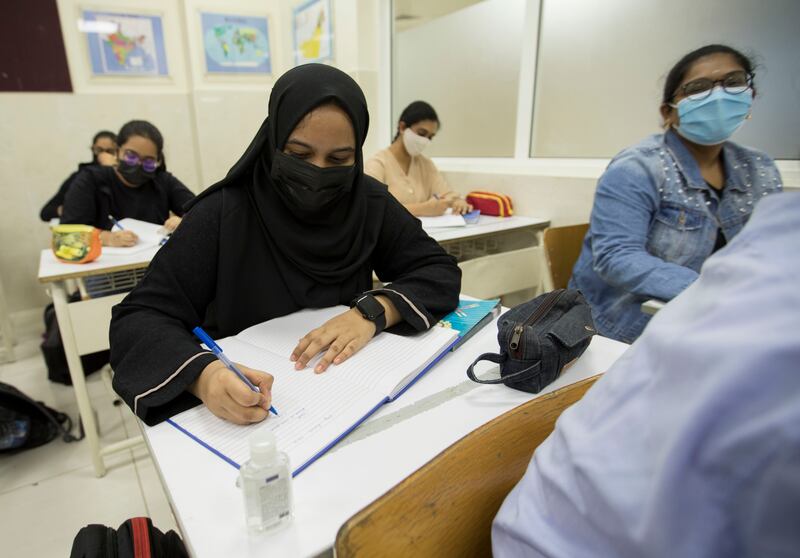 Pupils listen to their teacher on their first day of in-person learning at the Indian High School in Oud Metha, Dubai.