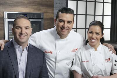 Host Buddy Valastro poses with advisors Vinnie Tubito and Erin McGinn pose together, as seen on Bake You Rich, Season 1.