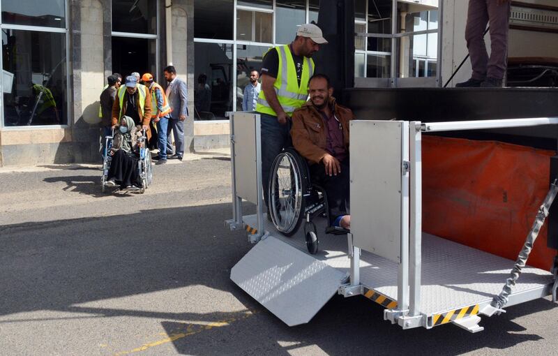 Airport workers push sick Yemenis in wheelchairs before boarding a UN medical evacuation plane at Sana'a airport, Yemen.  EPA
