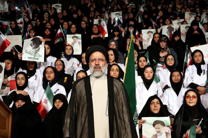 FILE -- In this April 29, 2017 file photo, hard-line cleric Ebrahim Raisi attends a 2017 presidential election rally in Tehran, Iran. On Thursday March 7, 2019, Iran's Supreme Leader Ayatollah Ali Khamenei named Raisi as the country's new judiciary chief. Thatâ€™s sparked concern from rights activists over his involvement in the execution of thousands in the 1980s. Raisiâ€™s selection comes after he was trounced by incumbent Hassan Rouhani in the countryâ€™s 2017 presidential election. (AP Photo/Ebrahim Noroozi, File)