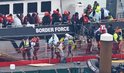 Migrants are brought in to Dover, Kent, on board a Border Force vessel following a small boat incident in the Channel in March. PA