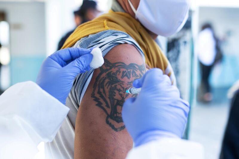 A prisoner receives the Sinovac Covid-19 vaccine, during a campaign to inoculate inmates at the Santiago Vazquez prison in Montevideo, Uruguay. Reuters