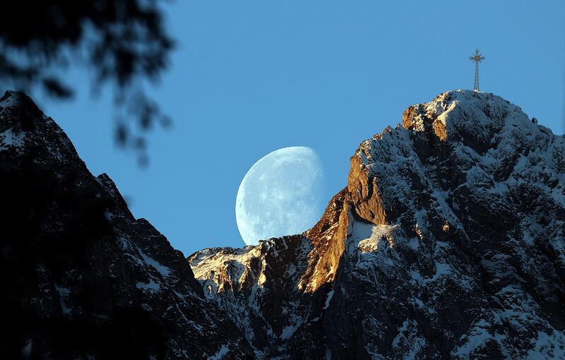 The moon sets behind the Great Giewont peak in the Tatra Mountains, Zakopane, southern Poland. EPA