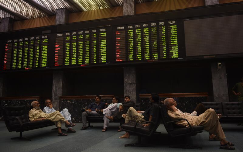 Pakistani stockbrokers at the Pakistan Stock Exchange (PSX) in Karachi. Moody's sees strong economic growth for the country. Rizwan Tabassum / AFP