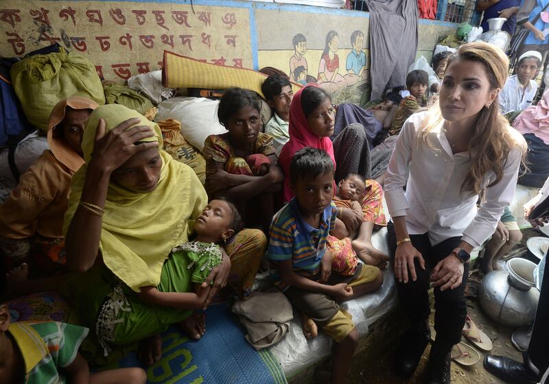 Jordan's Queen Rania sits with Rohingya refugees during her visit to the Kutupalong refugee camp in Ukhia. Tauseef Mustafa / AFP Photo