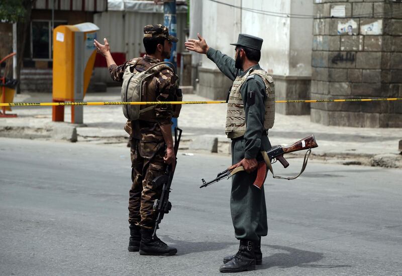 Afghan security personnel attend the site of a huge explosion in Kabul, Afghanistan. AP Photo