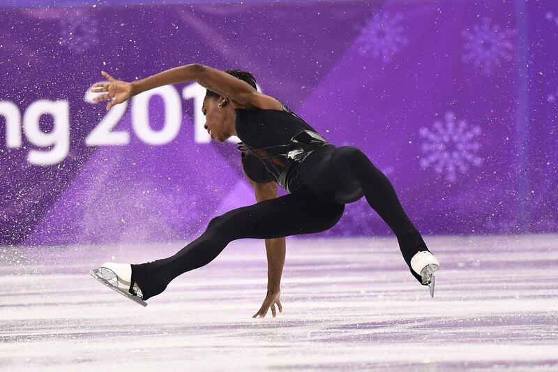 France's Vanessa James falls as she and partner France's Morgan Cipres compete in the pair skating free skating of the figure skating event. Aris Messinis / AFP