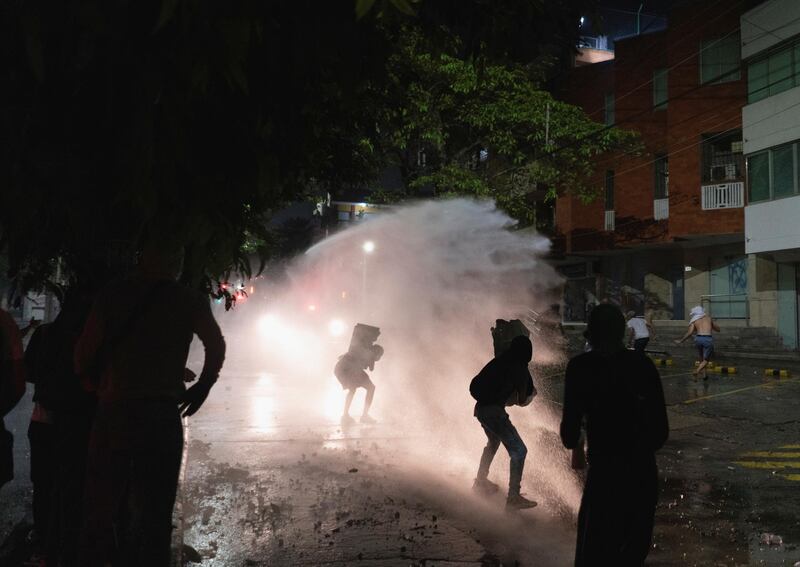 Demonstrators clash with police during a protest outside the Estadio Olimpico Romelio Martinez. Reuters
