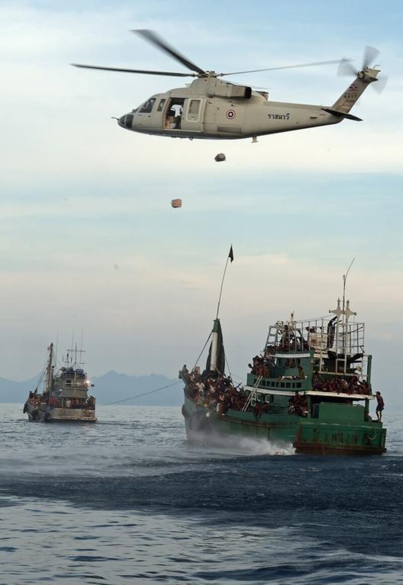 A Thai helicopter drops packages to Rohingya off the coast of Koh Lipe last month. Thailand says it has ‘already taken the initiative and provided critical humanitarian aid’. Christophe Archambault / AFP photo