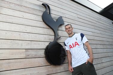 Gareth Bale poses in his new Tottenham shirt after completing a loan move back to his former club. Getty