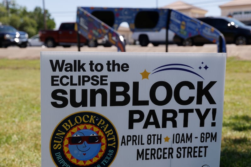 A placard invites people to a solar eclipse party in Dripping Springs, Texas. EPA