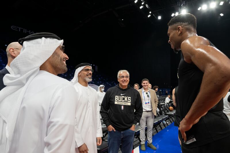 Sheikh Khaled and Mr Al Mubarak meet Milwaukee Bucks players.