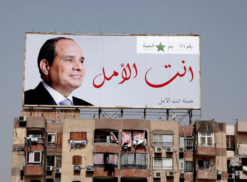 In this Monday, March 19, 2018 photo, an election banner for Egyptian President Abdel-Fattah el-Sissi hangs on top of a residential building with Arabic that reads, "you are the hope," on the ring road in Cairo, Egypt. Egyptians on social media are mocking the ubiquitous banners of el-Sissi raised ahead of this monthâ€™s election. He faces no serious competition, but authorities are pushing for a large turnout to lend legitimacy to the vote. In photos and videos shared online, the banners have been inserted into the background of iconic scenes from movies and TV shows. (AP Photo/Nariman El-Mofty)