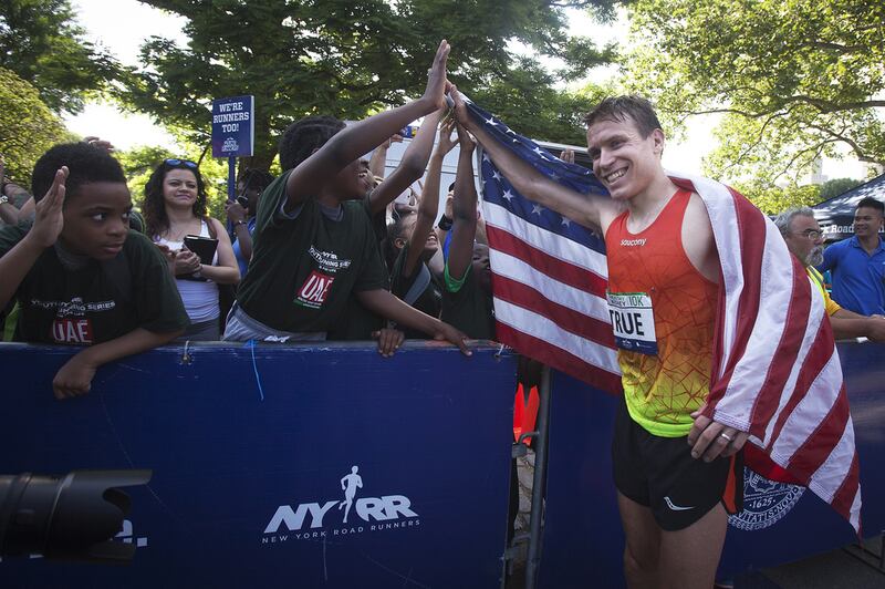 The American athlete Ben True celebrates after winning the 11th annual UAE Healthy Kidney 10k race in Central Park, New York. The race honours the late Sheikh Zayed, who was treated in the United States for a kidney complaint. Carlo Allegri for The National