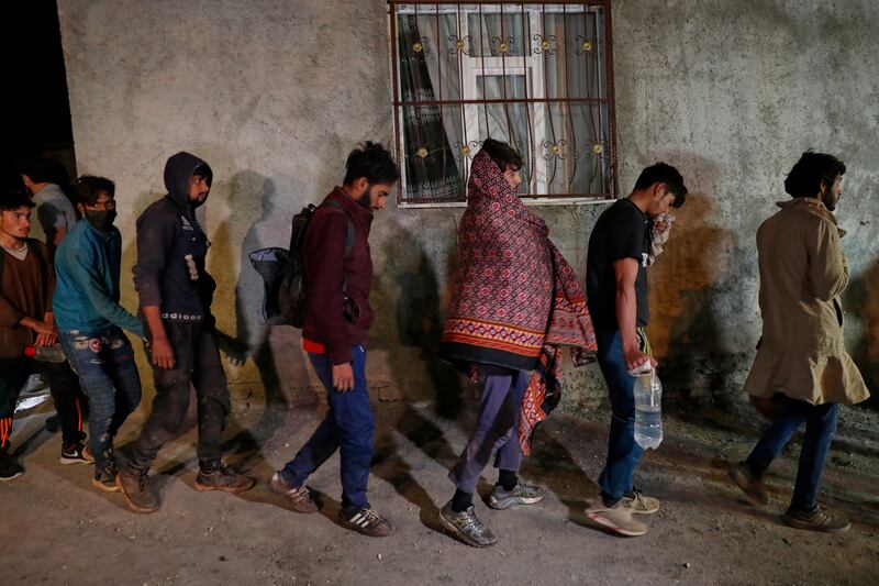Another group of Afghan migrants trudges towards a detention centre after being detained by Turkish security forces in the border city of Van. Reuters