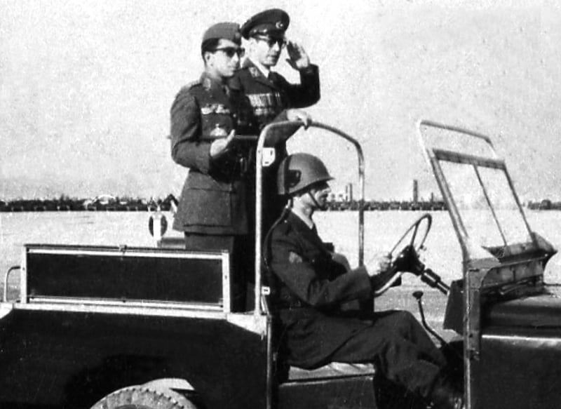 King Faisal II (L) inspects troops in Baghdad in 1953, when he became king and succeeded his father King Ghazi who was killed in 1939. Faisal II was three years old when his father died so his uncle became regent. AFP