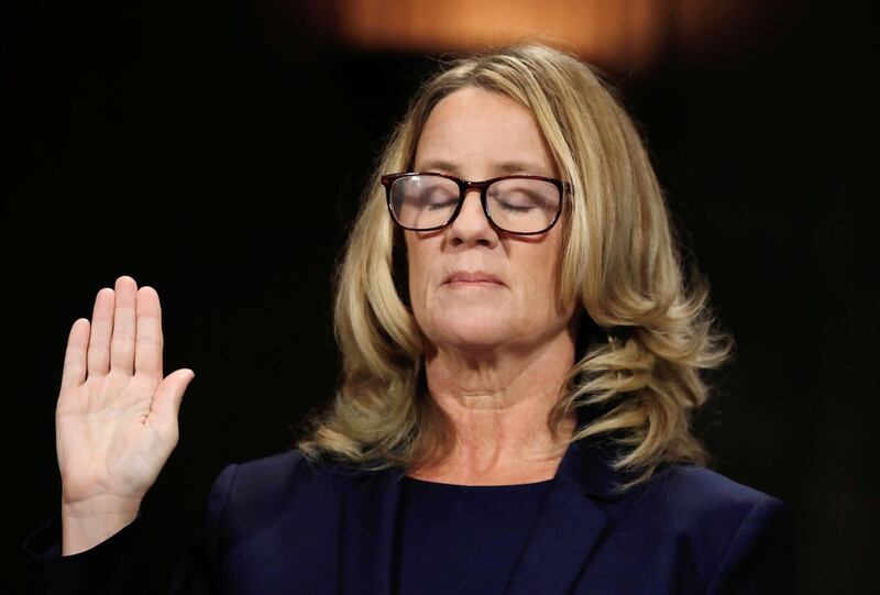 Christine Blasey Ford closes her eyes as she is sworn in before testifying to the Senate Judiciary Committee confirmation hearing for President Donald Trump's Supreme Court nominee Judge Brett Kavanaugh on Capitol Hill on September 27, 2018. Reuters