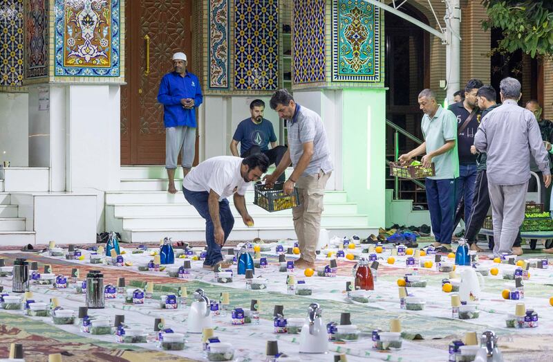 Preparation for iftar at Imam Hussein Mosque in Al Satwa, Dubai.  Leslie Pableo for The National
