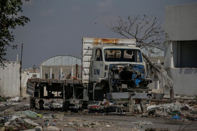 A destroyed UN aid lorry sits among rubble in Khan Younis after Israeli troops pulled out of the area. EPA