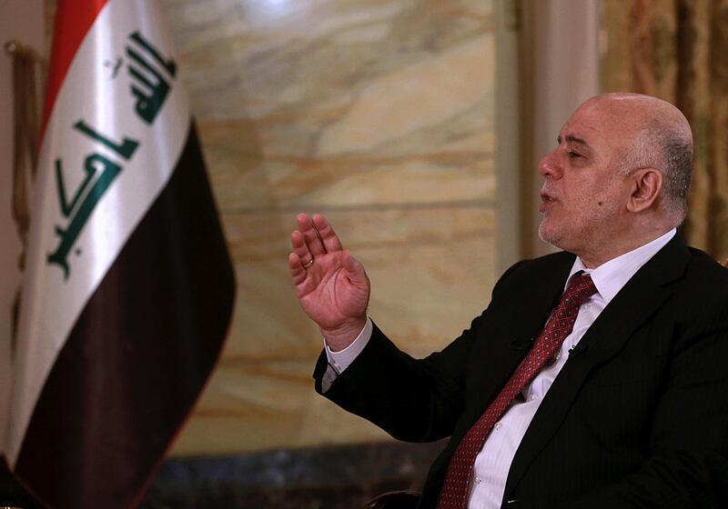 FILE - in this Sept. 16, 2017 file photo, Iraqi Prime Minister Haider al-Abadi speaks during an interview with The Associated Press in Baghdad, Iraq. Al-Abadi said Saturday, Jan. 14, 2018, that he will lead a "cross-sectarian" list in national elections proposed for May, hoping to build off last year's victory against the Islamic State group. (AP Photo/Khalid Mohammed, File)