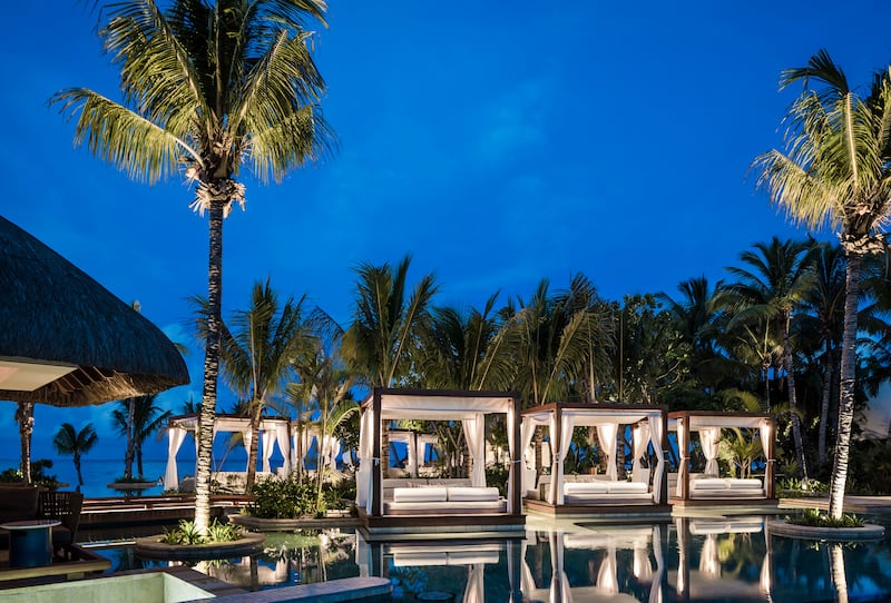 One of three resort pools in the evening.