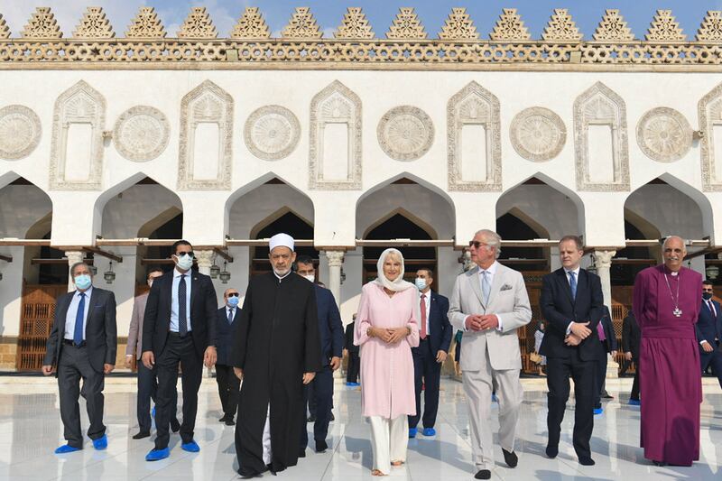The Grand Imam, centre left, receives Prince Charles, centre-right, and Camilla, centre, upon their arrival at the mosque.  AFP