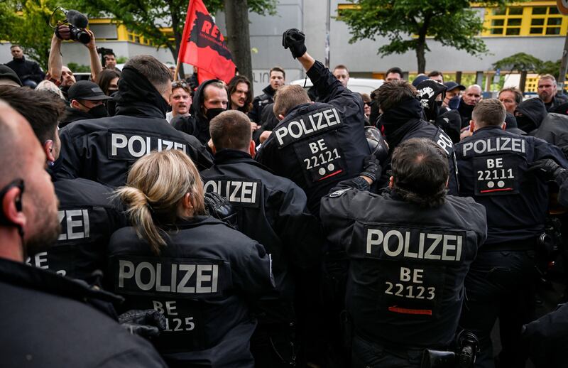 Police officers and protesters scuffle during a demonstration in Berlin in solidarity with Lina E, who was sentenced to more than five years in jail for taking part in a series of attacks on neo-Nazis and other right-wing extremists. EPA
