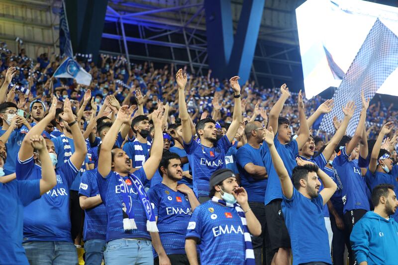 Al Hilal supporters cheer. AFP
