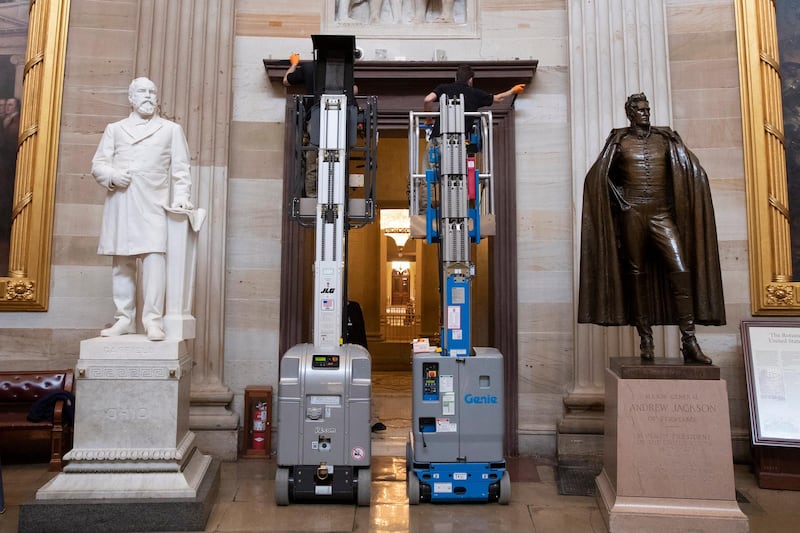 Workers on lifts prepare the doorways of the Capitol Rotunda for the inaugural drapery that will be hung for the 20 January inauguration when Joe Biden will be sworn-in as President of the United States, on Capitol Hill in Washington, DC, USA. EPA