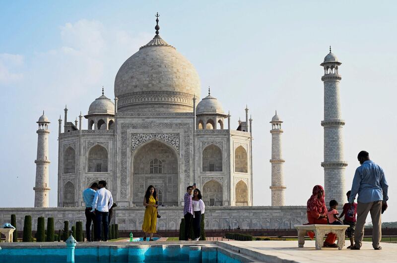 Tourists at the Taj Mahal after it reopened to visitors when authorities eased coronavirus restrictions in Agra. AFP
