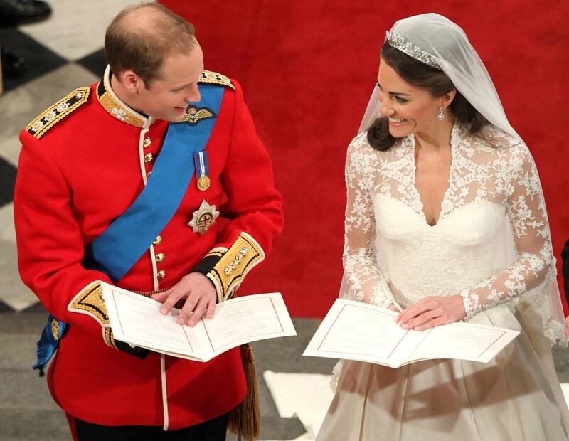 LONDON, ENGLAND - APRIL 29: Prince William sings beside his bride Catherine Middleton during their wedding at Westminster Abbey on April 29, 2011 in London, England.  The marriage of Prince William, the second in line to the British throne, to Catherine Middleton is being held in London today. The marriage of the second in line to the British throne is to be led by the Archbishop of Canterbury and will be attended by 1900 guests, including foreign Royal family members and heads of state. Thousands of well-wishers from around the world have also flocked to London to witness the spectacle and pageantry of the Royal Wedding.  (Photo by Andrew Milligan - WPA Pool/Getty Images)