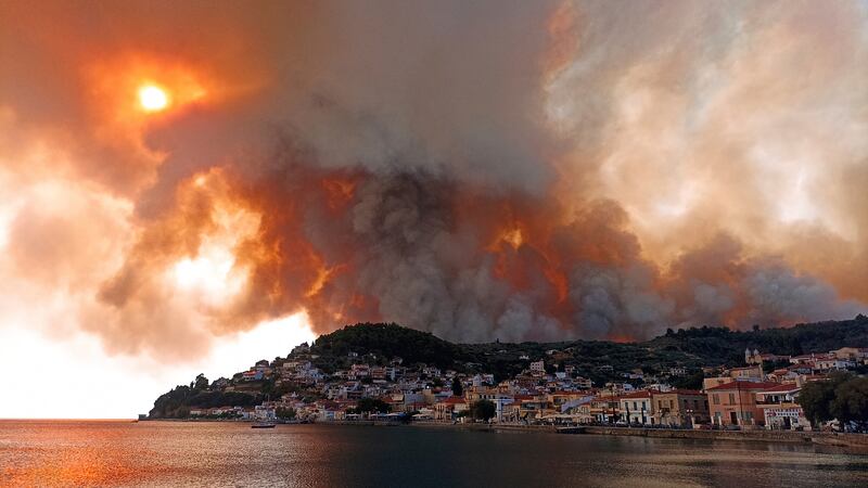 Fires rage in the mountains near Limni, on the Greek island of Evia, about 160 kilometres north of Athens.
