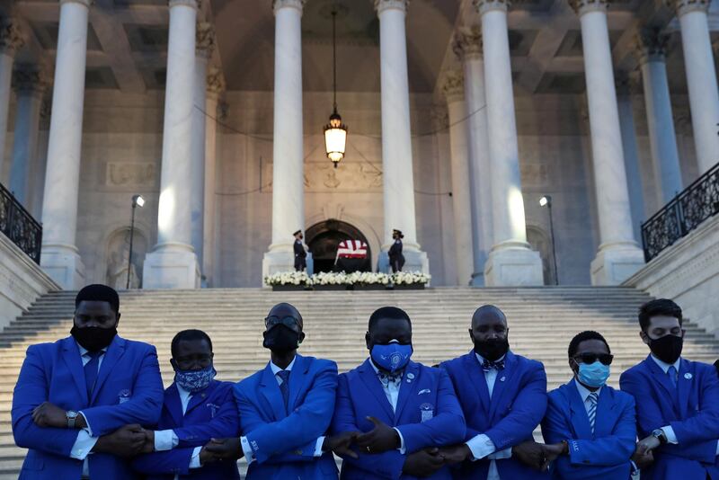 FMembers of Phi Beta Sigma Fraternity Inc sing their fraternity hymn as others pay their respects at the casket of civil rights pioneer and longtime U.S. Representative John Lewis in Washington, DC. REUTERS