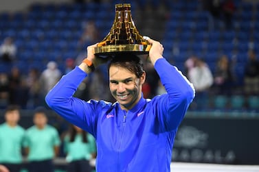 epa08085792 Rafael Nadal of Spain raises his trophy after winning against Stefanos Tsitsipas of Greece during the final match at the Mubadala World Tennis Championship 2019 in Abu Dhabi, United Arab Emirates, 21 December 2019. EPA/STR