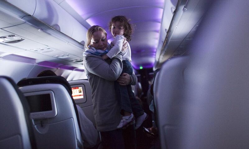 Introducing child-free zones on flights is impractical, readers say. Robert Nickelsberg / Getty Images