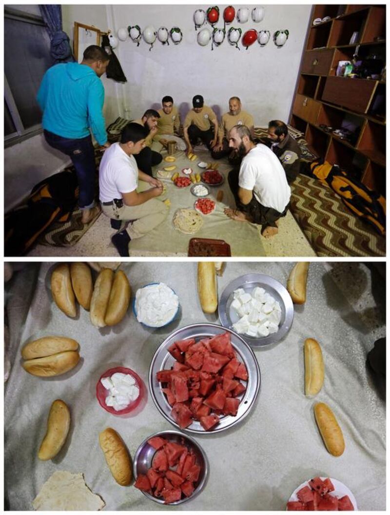 Syrian civil defence members breaking fast in the rebel-controlled area of Maaret Al Numan town, in Idlib province, Syria on June 10, 2016. Photo by Khalil Ashawi