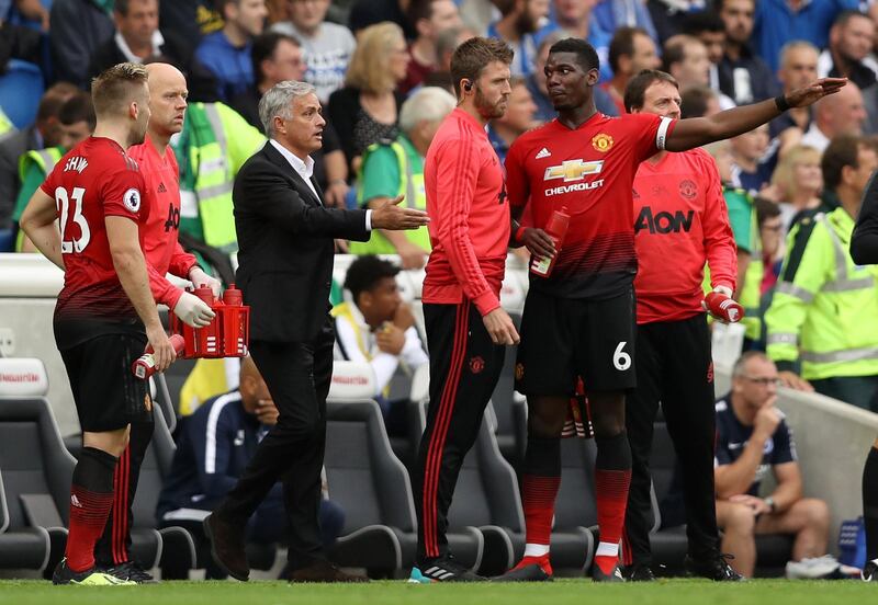 BRIGHTON, ENGLAND - AUGUST 19:  Jose Mourinho, Manager of Manchester United speaks with Paul Pogba of Manchester United during the Premier League match between Brighton & Hove Albion and Manchester United at American Express Community Stadium on August 19, 2018 in Brighton, United Kingdom.  (Photo by Dan Istitene/Getty Images)