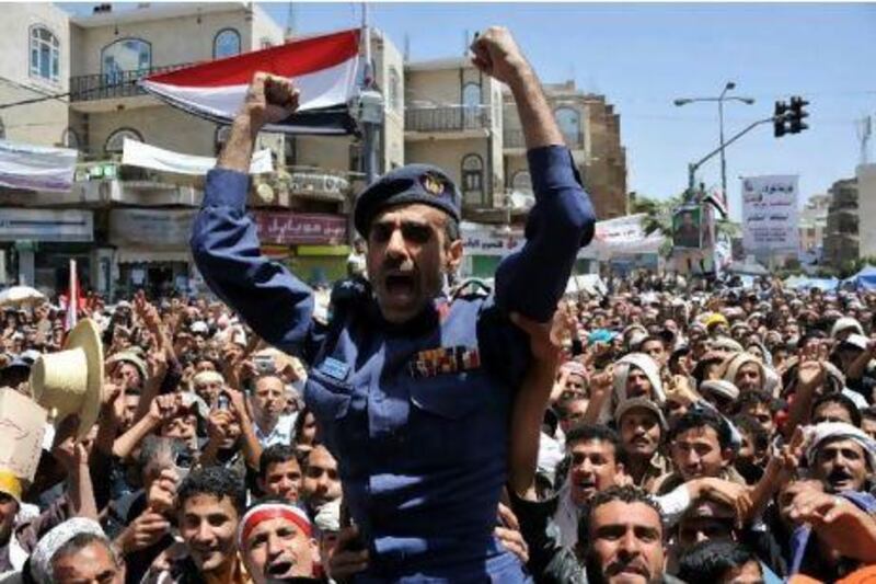 Anti-government demonstrators carry a Yemeni army officer as he joins demonstrations demanding the departure of President Ali Abdullah Saleh during a demonstration in Sana'a yesterday.