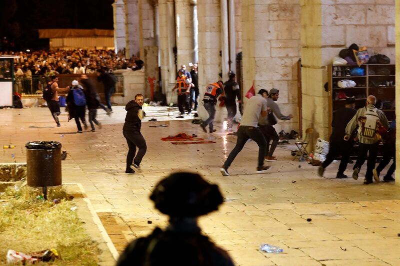 Israeli security forces and Palestinian protesters clash near Al Aqsa Mosque in Jerusalem, on May 7, 2021. AFP
