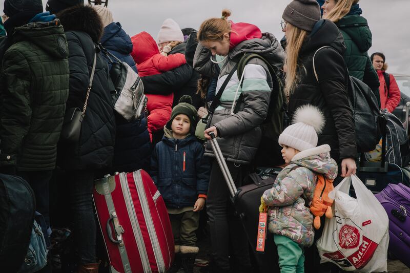 Mothers with their children at the Palanca border crossing into Moldova.