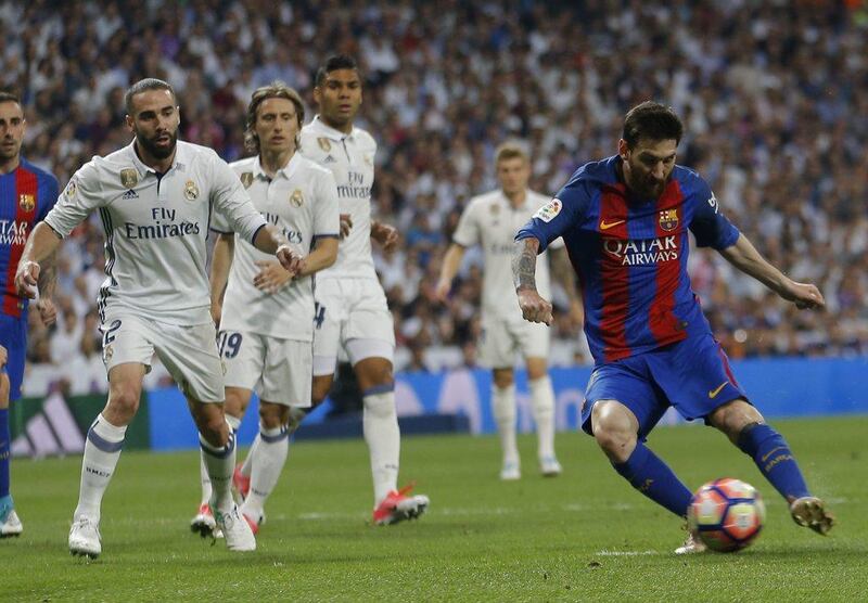 Barcelona's Lionel Messi celebrates after scoring the winning goal against Real Madrid at the Santiago Bernabeu stadium in Madrid on April 23, 2017. Gerard Julien / AFP