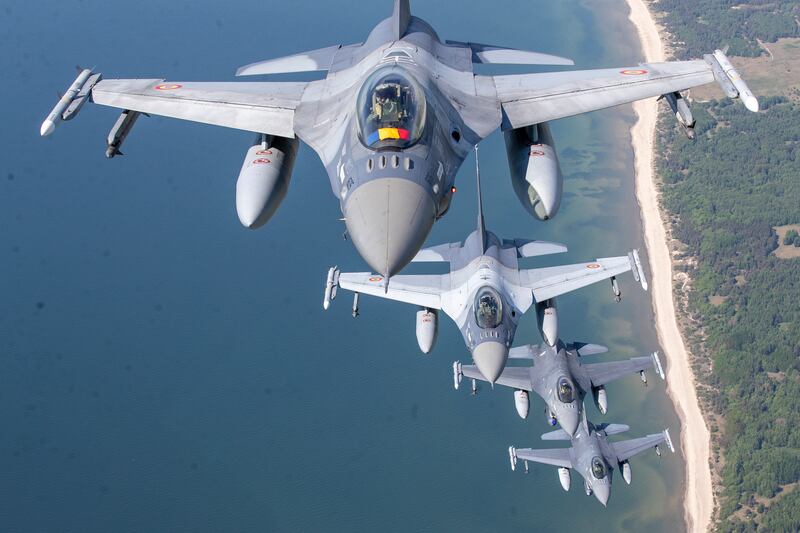 A Romanian Air Force F-16 fighter jet leads Portuguese Air Force F-16s during Nato's Baltic Air Policing Mission over the Baltic Sea in Lithuanian airspace. AP 