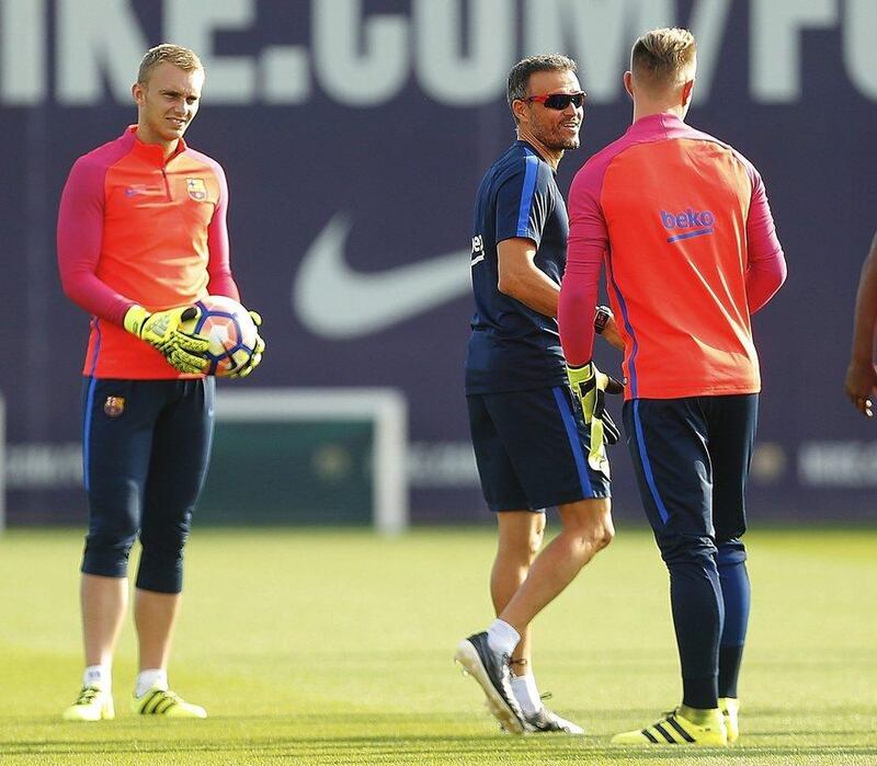 Barcelona manager Luis Enrique, centre, talks to goalkeepers Jasper Cillessen, left, and Marc Andre Ter Stegen. Alejandro Garcia / EPA